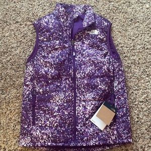 About one year old but never worn before north face vest price tags still